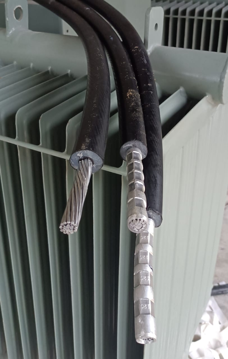 Crimped cables on a transformer wings